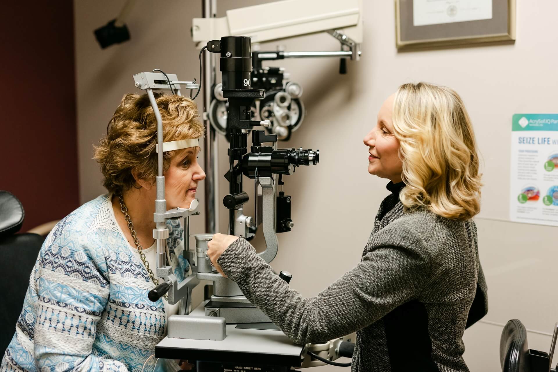 Doctor performing an eye exam on a patient